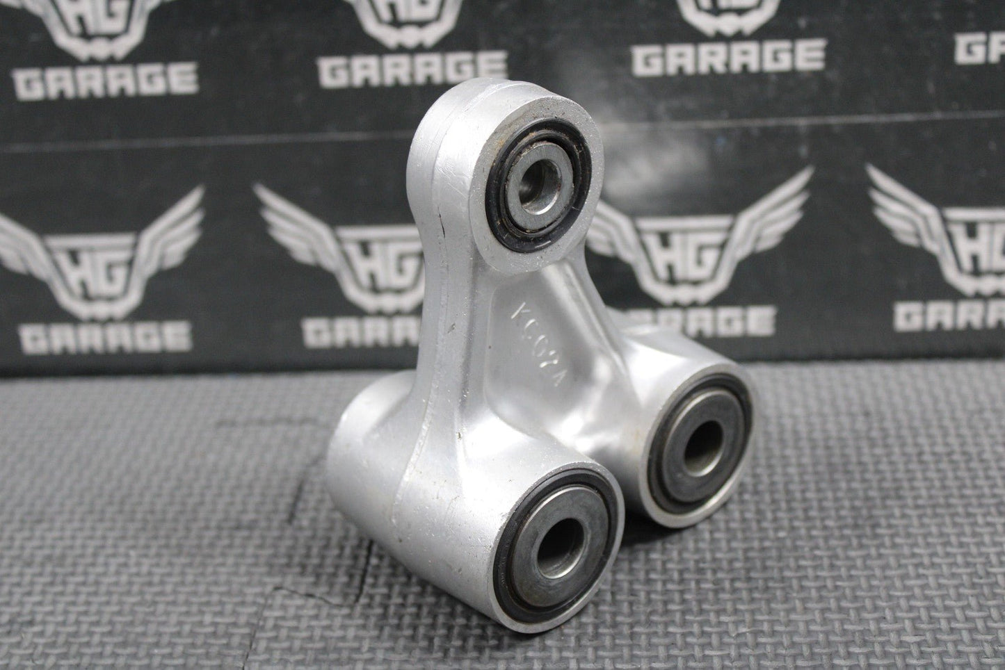 2003 2004 HONDA CRF450R OEM REAR SHOCK LINKAGE CUSHION ARM 52465 - MEB - 750 - hggarage