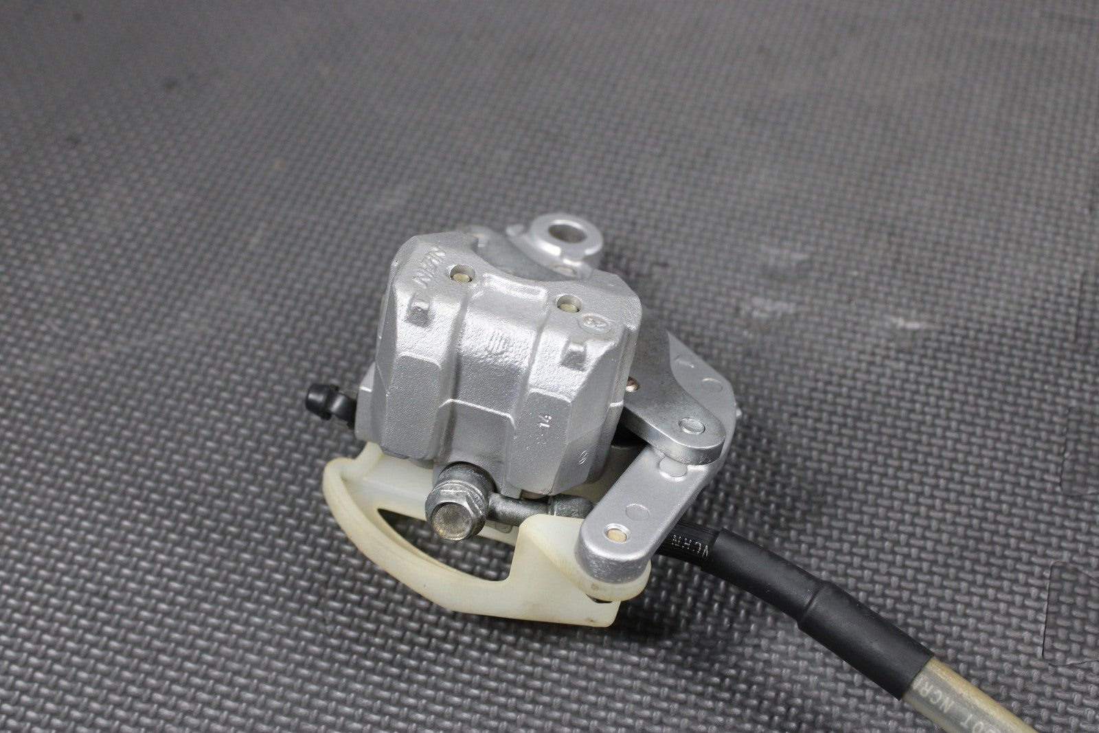 2003 KAWASAKI KX65 OEM NISSIN REAR BACK BRAKE CALIPER 43041 - 1711 43095 - 1228 - hggarage