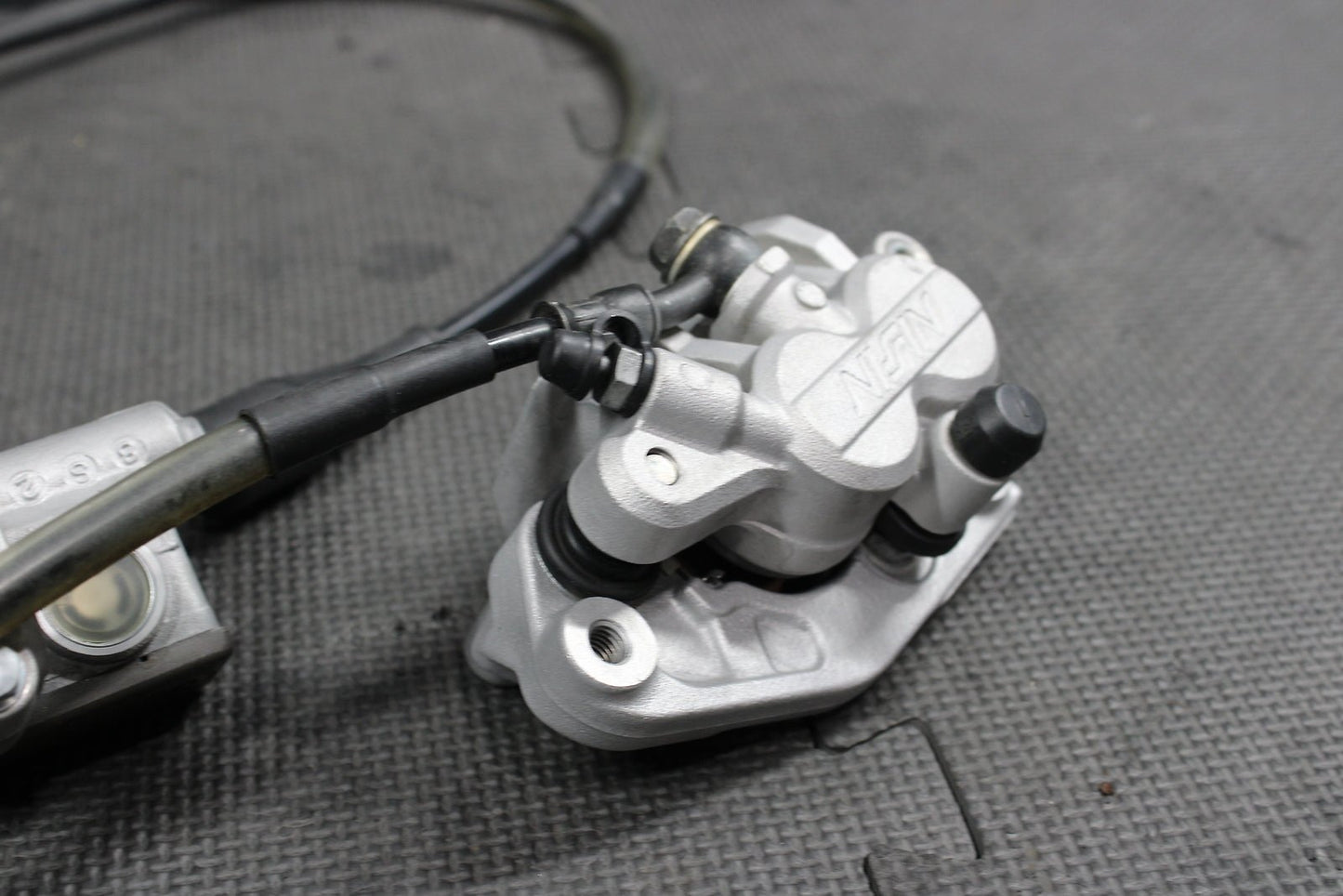 2009 Kawasaki KX250F OEM Nissin Front Brake Caliper Master Cylinder Complete - hggarage