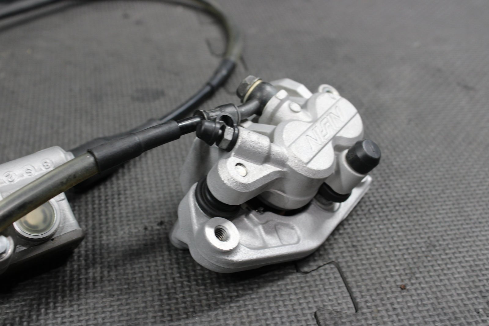 2009 Kawasaki KX250F OEM Nissin Front Brake Caliper Master Cylinder Complete - hggarage