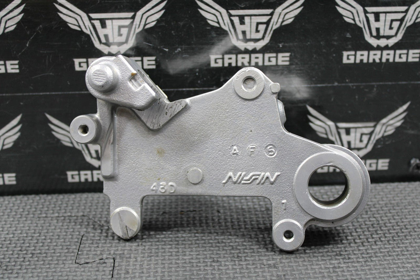 1995 SUZUKI 93 - 95 RMX250 OEM NISSIN REAR BRAKE CALIPER HANGER 69351 - 43D01 - hggarage
