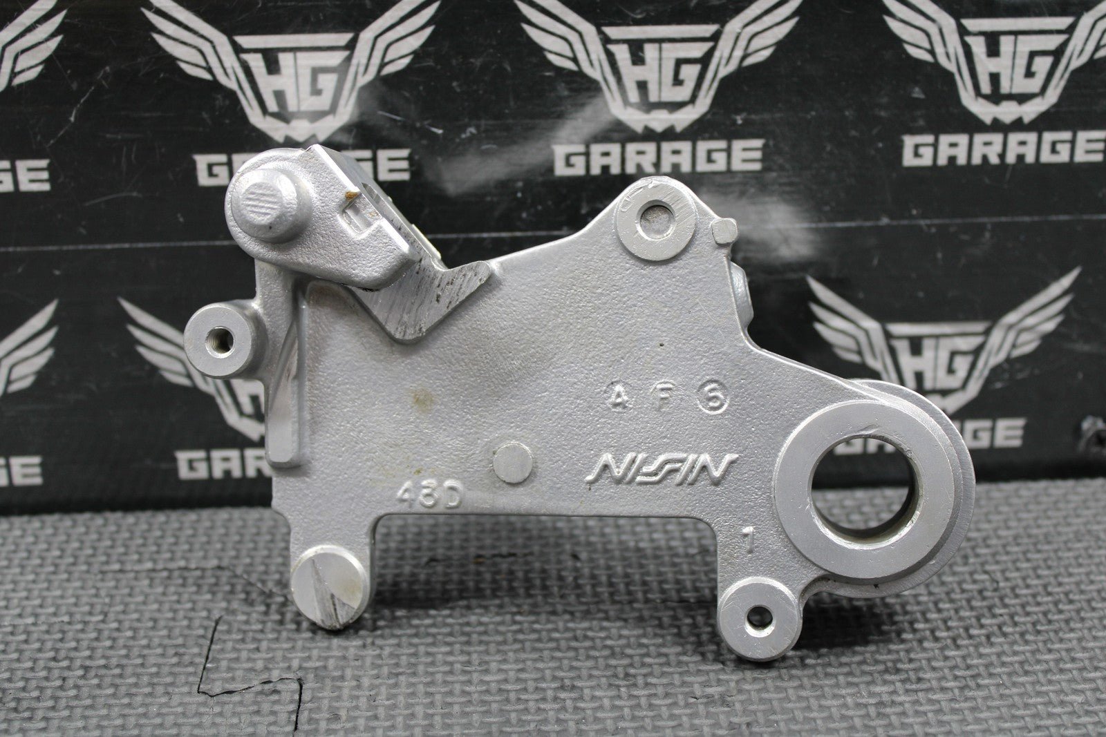 1995 SUZUKI 93 - 95 RMX250 OEM NISSIN REAR BRAKE CALIPER HANGER 69351 - 43D01 - hggarage