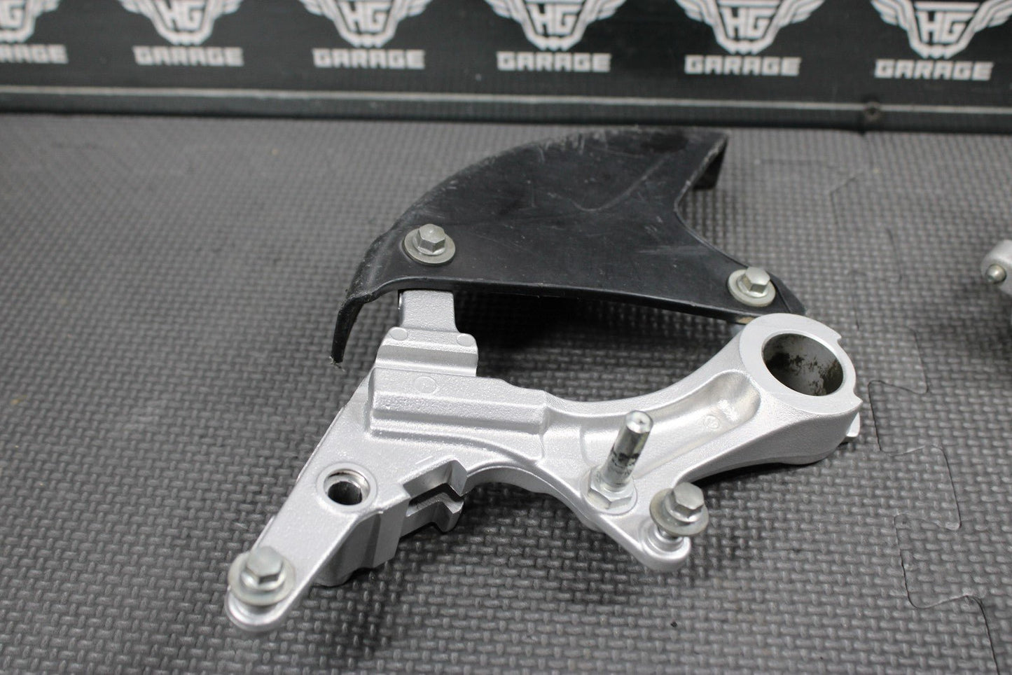 2014 KAWASAKI KX250F 04 - 18 OEM NISSIN REAR BACK BRAKE CALIPER HANGER 43080 - 0230 - hggarage