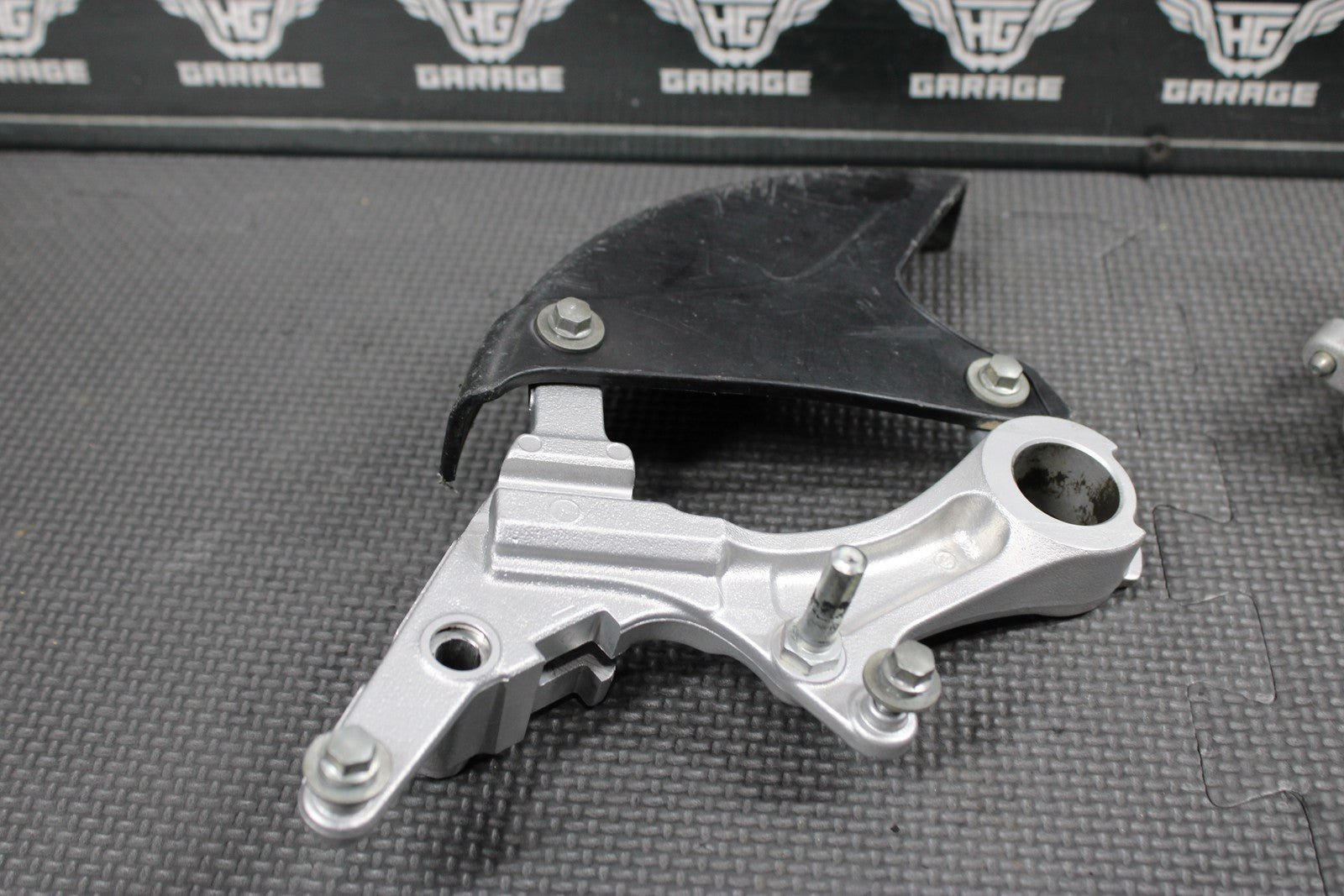 2014 KAWASAKI KX250F 04 - 18 OEM NISSIN REAR BACK BRAKE CALIPER HANGER 43080 - 0230 - hggarage