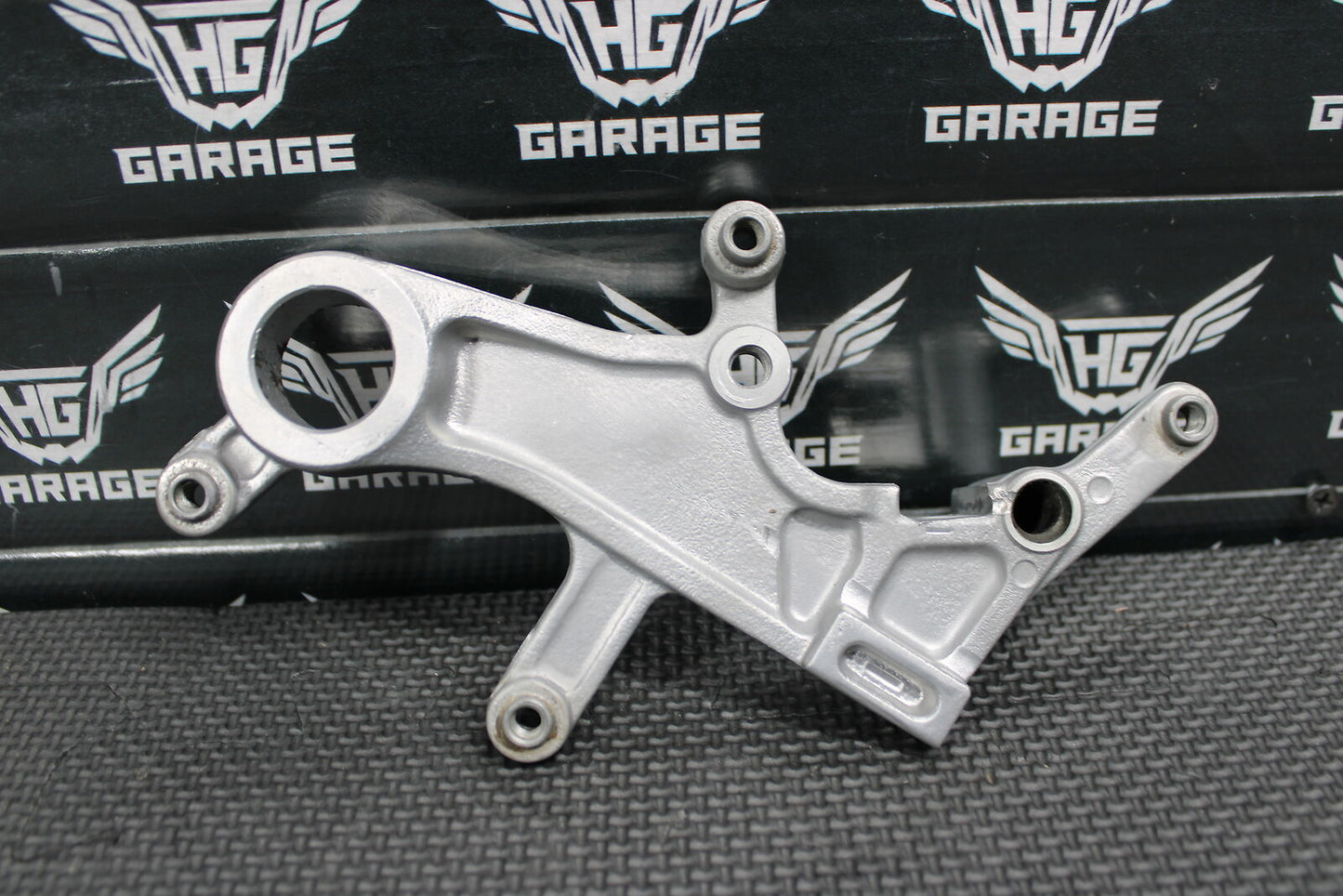 2012 HONDA CRF450R OEM REAR BRAKE CALIPER HANGER MOUNTING BRACKET 43190-KRN-711