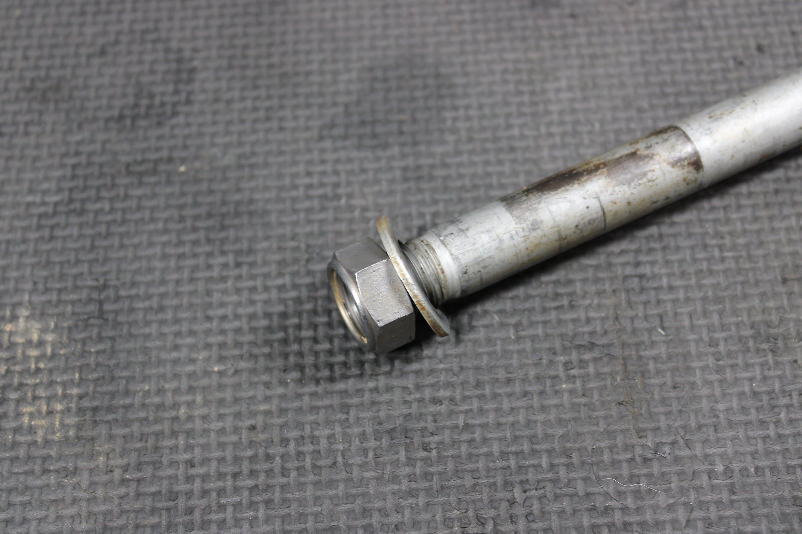 2012 KAWASAKI KX250F OEM REAR BACK SWINGARM BOLT SUSPENSION PIVOT AXLE 33032 - 001 - hggarage