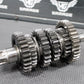 1986 KAWASAKI KDX200 OEM TRANSMISSION TRANNY GEARBOX SHIFT FORKS DRUM GEARS - hggarage