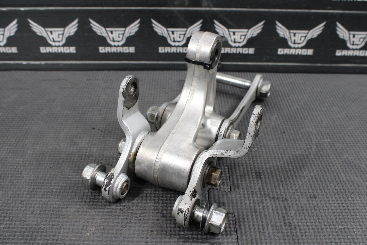 2014 KAWASAKI KX100 OEM REAR SHOCK LINKAGE RELAY ARM DOGBONE ASSEMBLY - hggarage