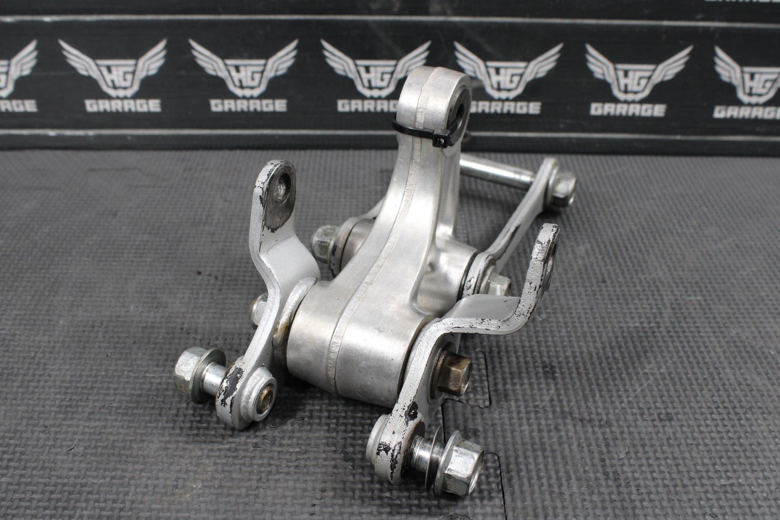 2014 KAWASAKI KX100 OEM REAR SHOCK LINKAGE RELAY ARM DOGBONE ASSEMBLY - hggarage