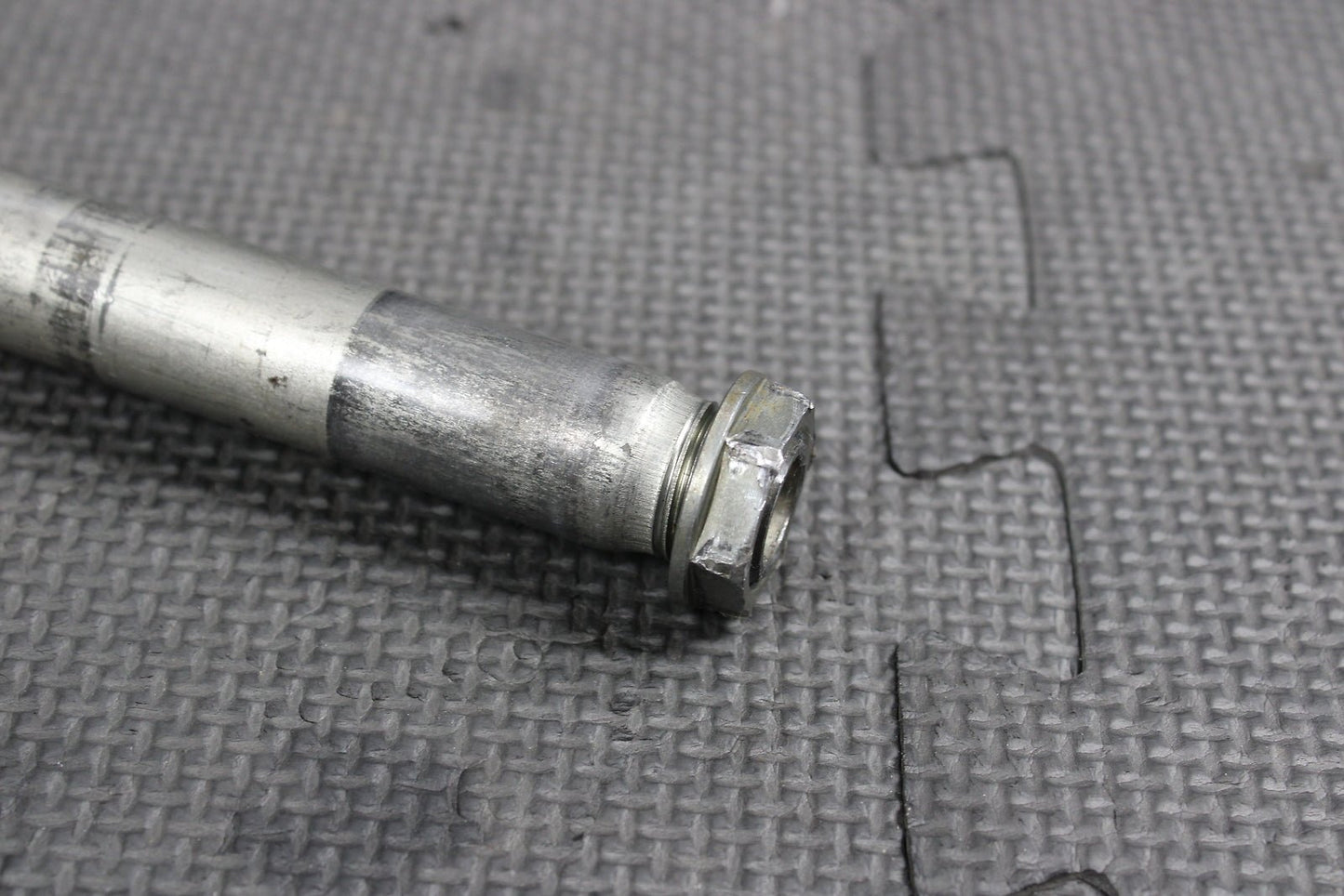 2009 Kawasaki KX250F OEM Front Wheel Rim Axle Pivot Bolt - hggarage