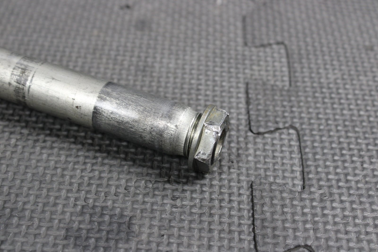 2009 Kawasaki KX250F OEM Front Wheel Rim Axle Pivot Bolt - hggarage