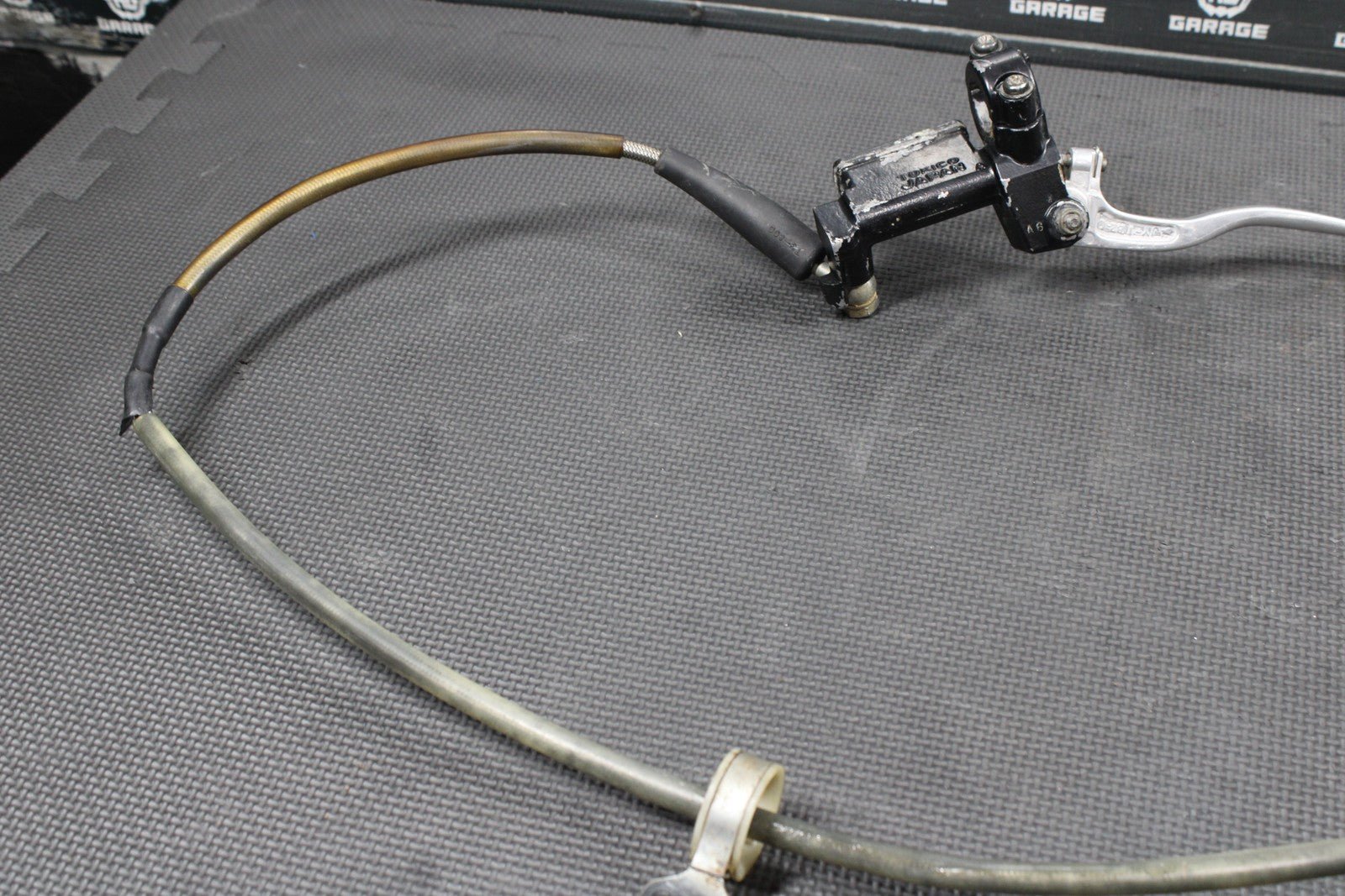 1986 KAWASAKI KDX200 OEM TOKICO FRONT BRAKE CALIPER MASTER CYLINDER ASSEMBLY - hggarage
