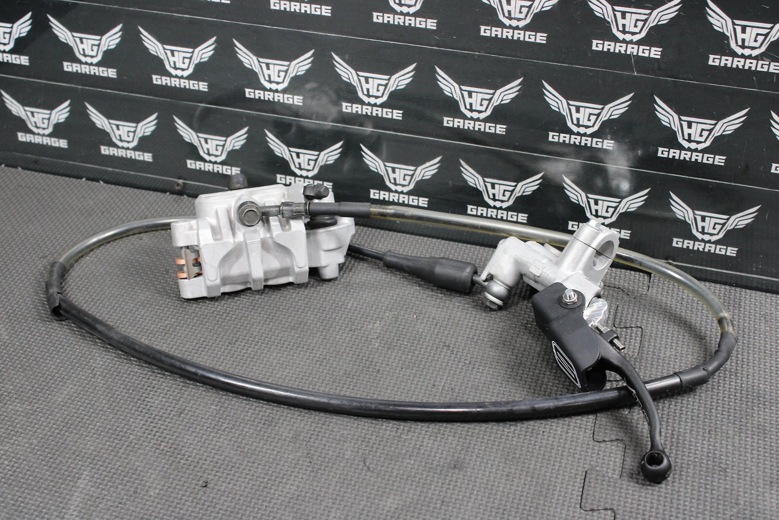 2009 Kawasaki KX250F OEM Nissin Front Brake Caliper Master Cylinder Complete - hggarage