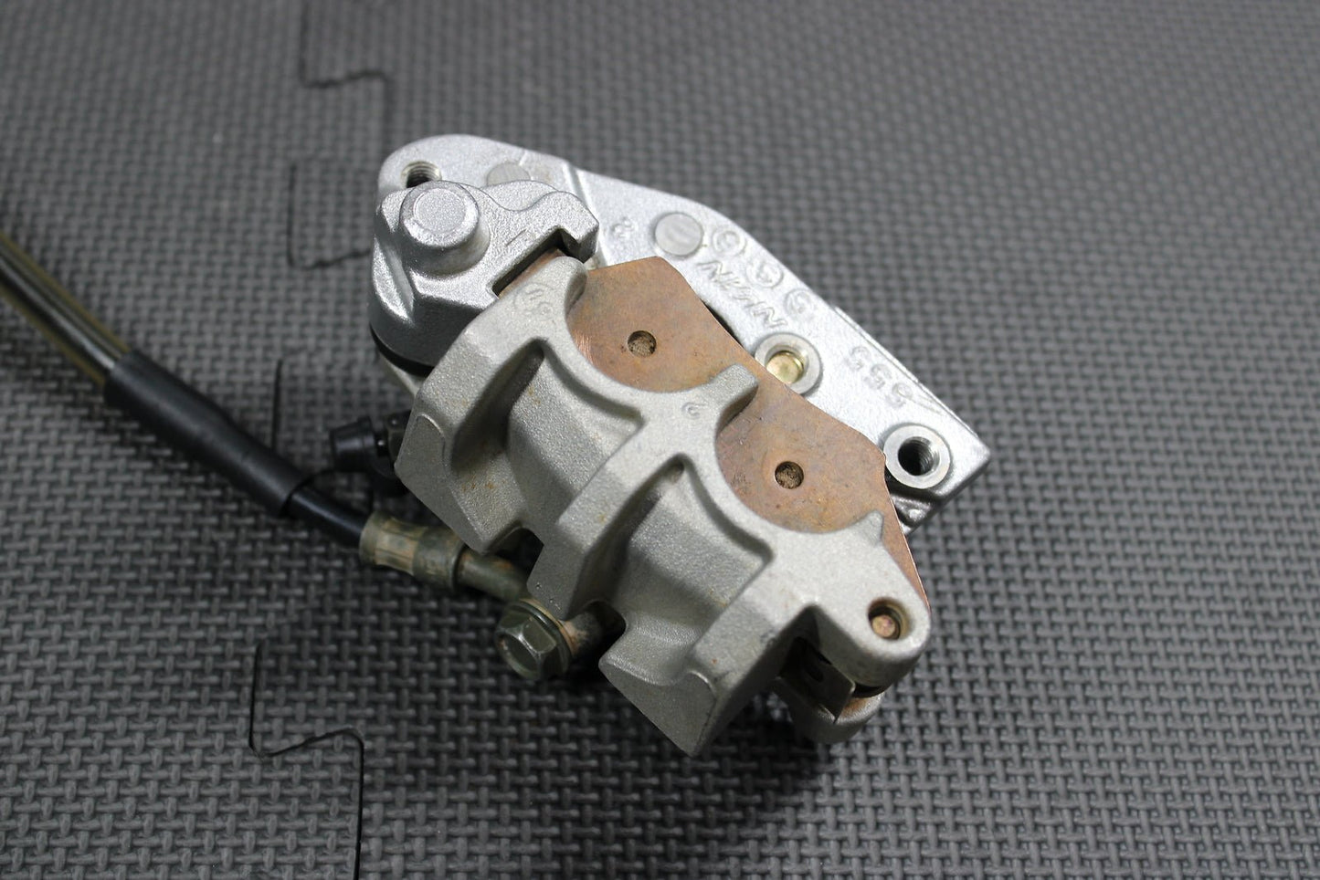 2006 Kawasaki KX450F OEM Nissin Front Brake Caliper Master Cylinder 43015 - 0167 - hggarage