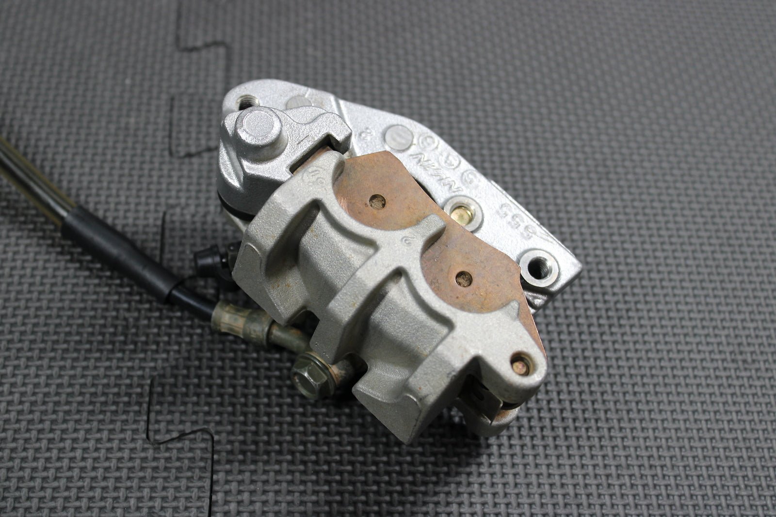 2006 Kawasaki KX450F OEM Nissin Front Brake Caliper Master Cylinder 43015 - 0167 - hggarage
