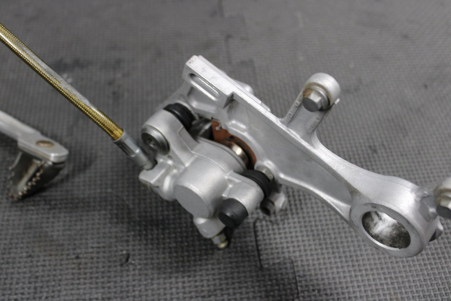 2009 HONDA CRF450R OEM NISSIN REAR BACK BRAKE CALIPER MASTER CYLINDER ASSEMBLY - hggarage