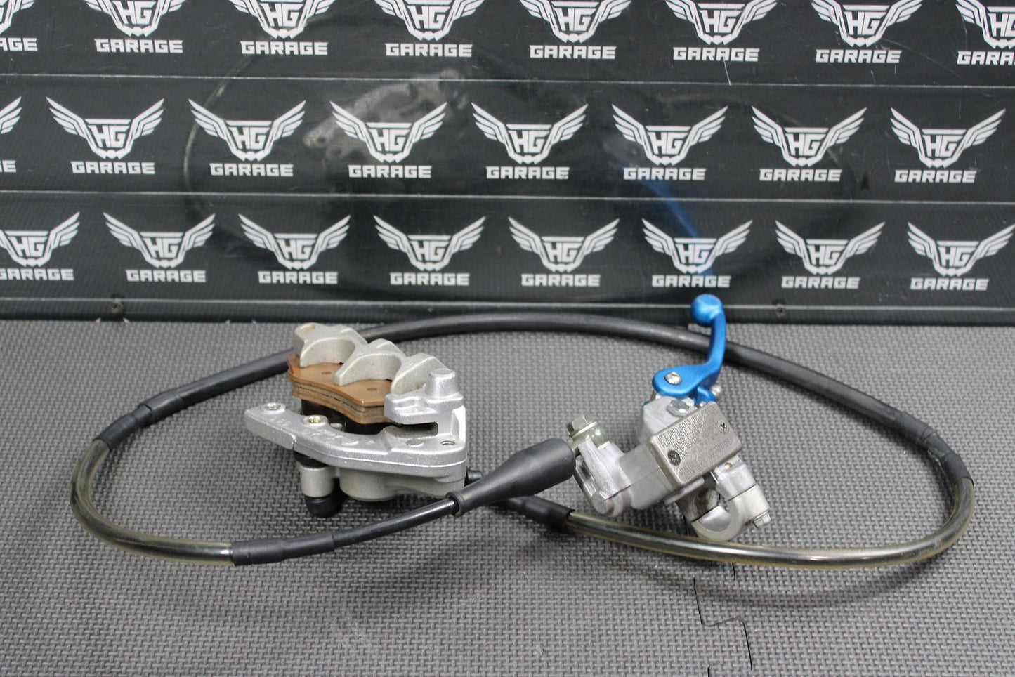 2006 Kawasaki KX450F OEM Nissin Front Brake Caliper Master Cylinder 43015 - 0167 - hggarage