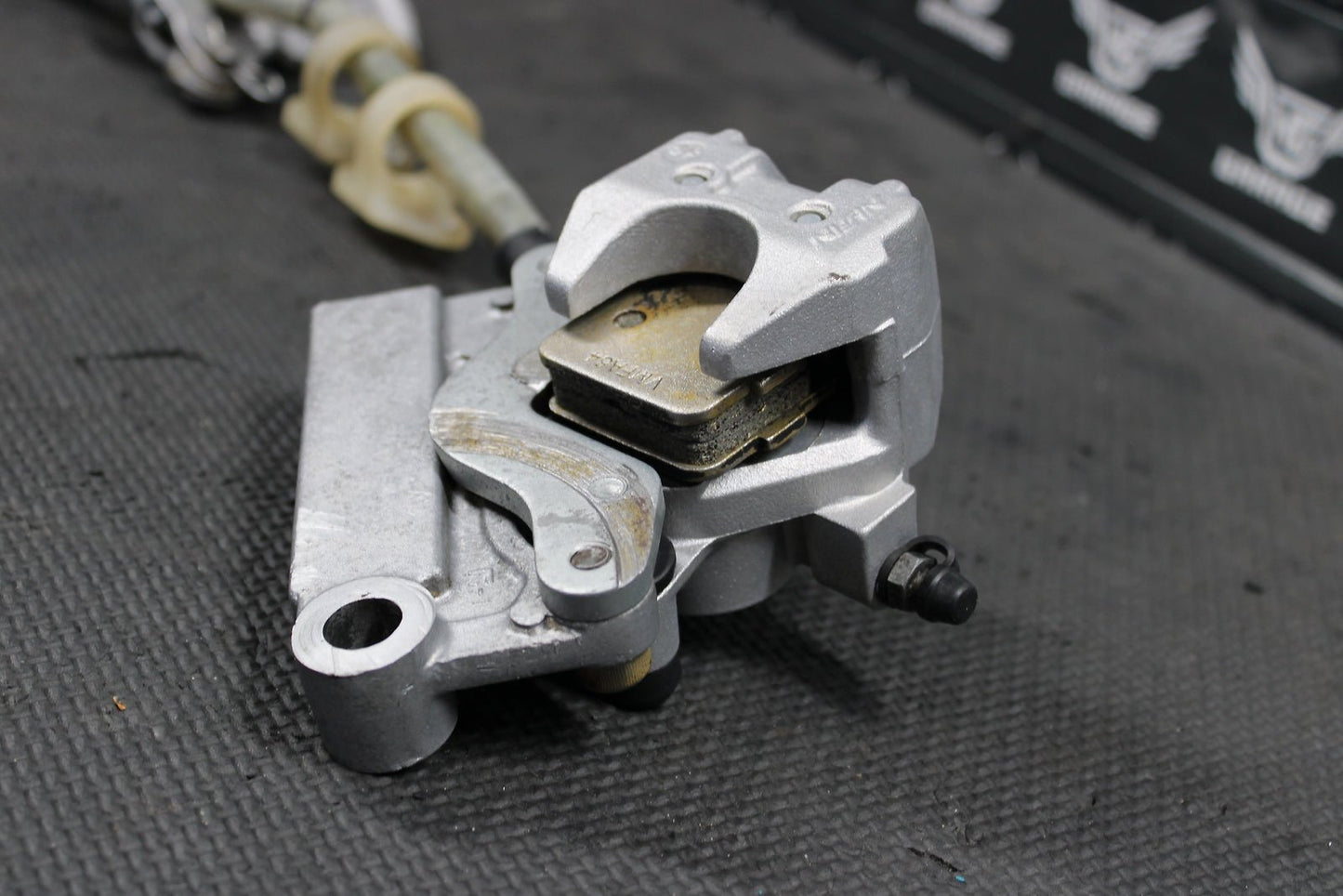 1995 KAWASAKI KX80 OEM NISSIN REAR BACK BRAKE CALIPER MASTER CYLINDER ASSEMBLY - hggarage