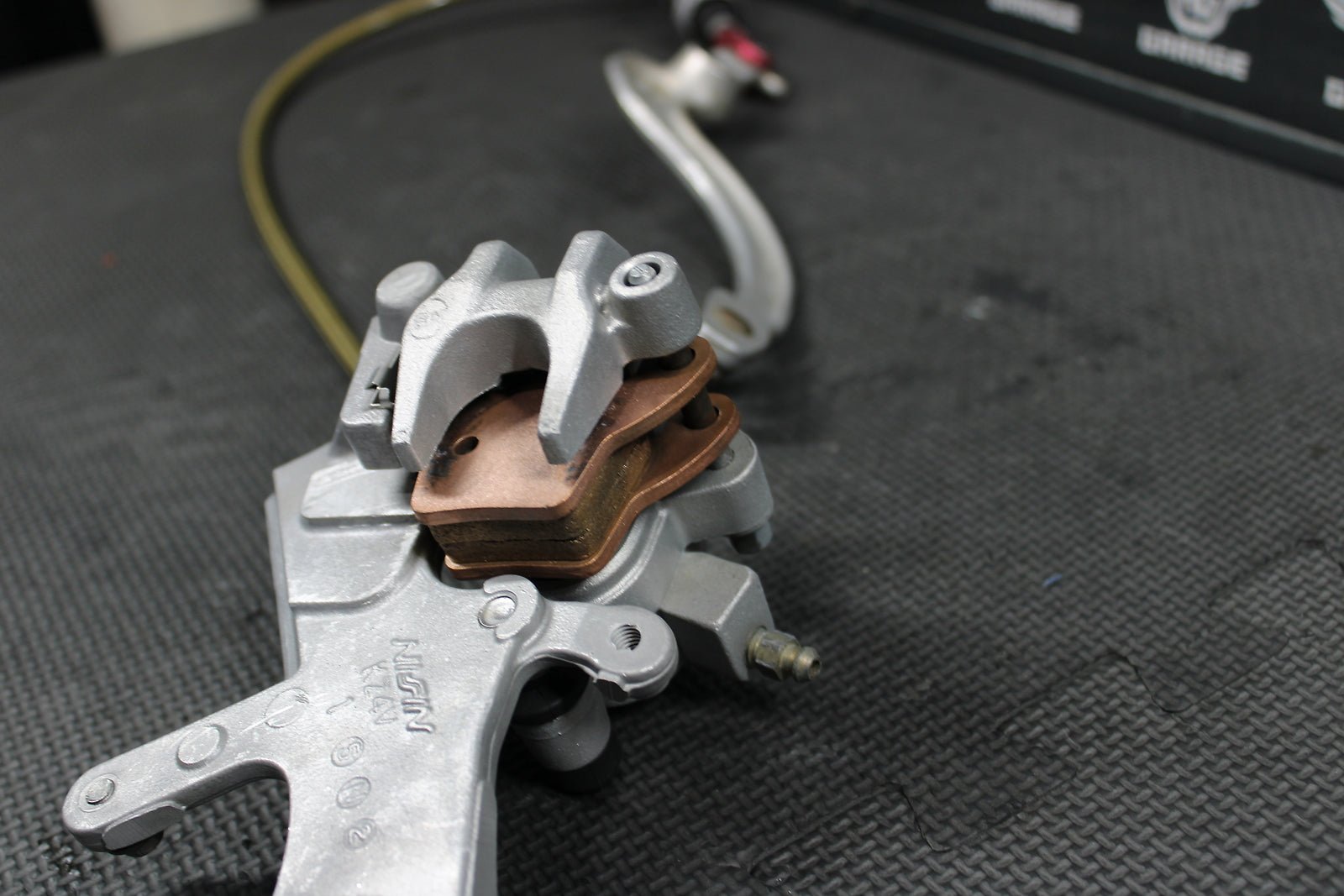 2009 HONDA CRF450R OEM NISSIN REAR BACK BRAKE CALIPER MASTER CYLINDER ASSEMBLY - hggarage