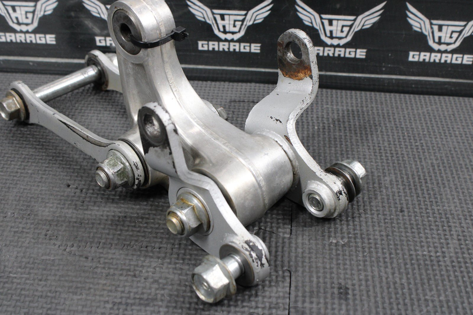 2014 KAWASAKI KX100 OEM REAR SHOCK LINKAGE RELAY ARM DOGBONE ASSEMBLY - hggarage