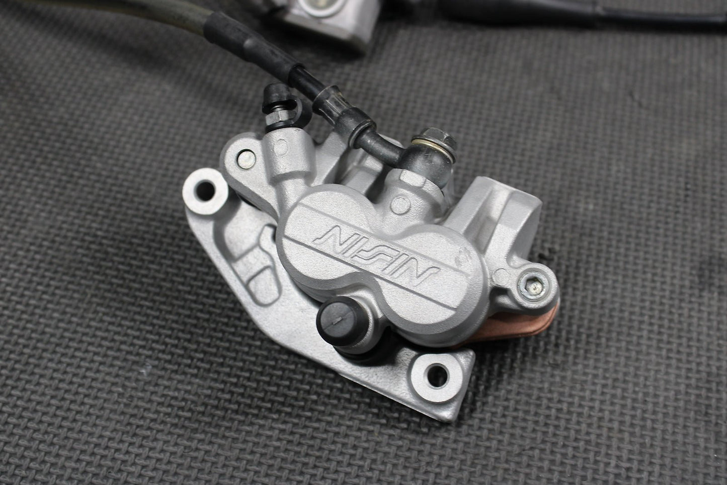 2009 Kawasaki KX250F OEM Nissin Front Brake Caliper Master Cylinder Complete - hggarage