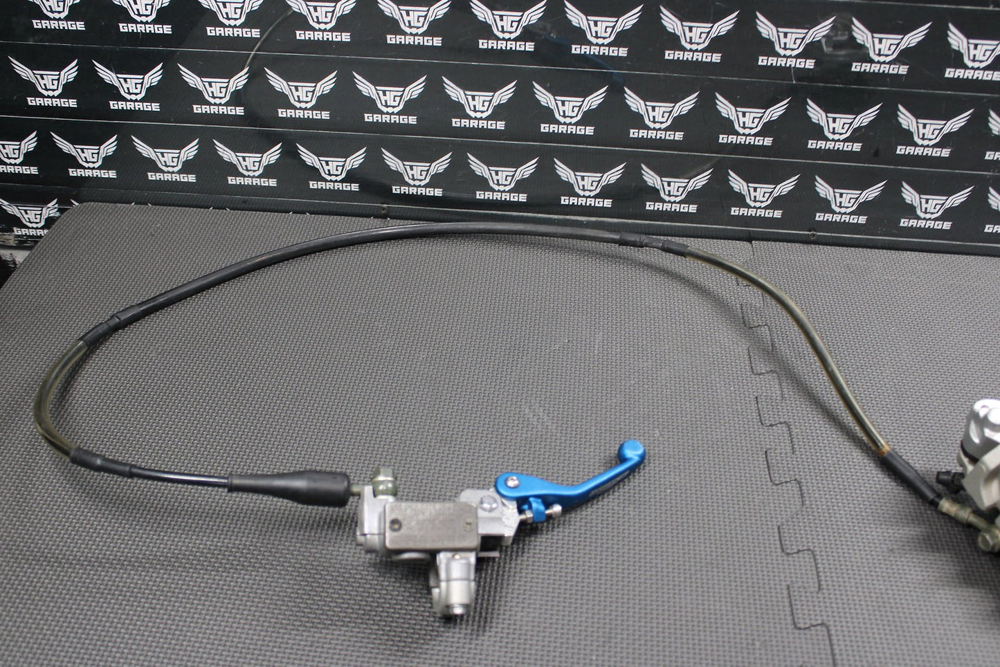 2006 Kawasaki KX450F OEM Nissin Front Brake Caliper Master Cylinder 43015 - 0167 - hggarage