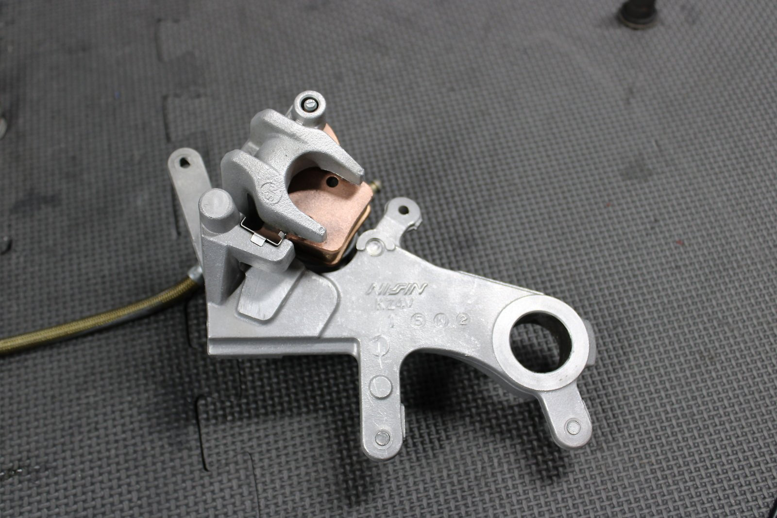 2009 HONDA CRF450R OEM NISSIN REAR BACK BRAKE CALIPER MASTER CYLINDER ASSEMBLY - hggarage