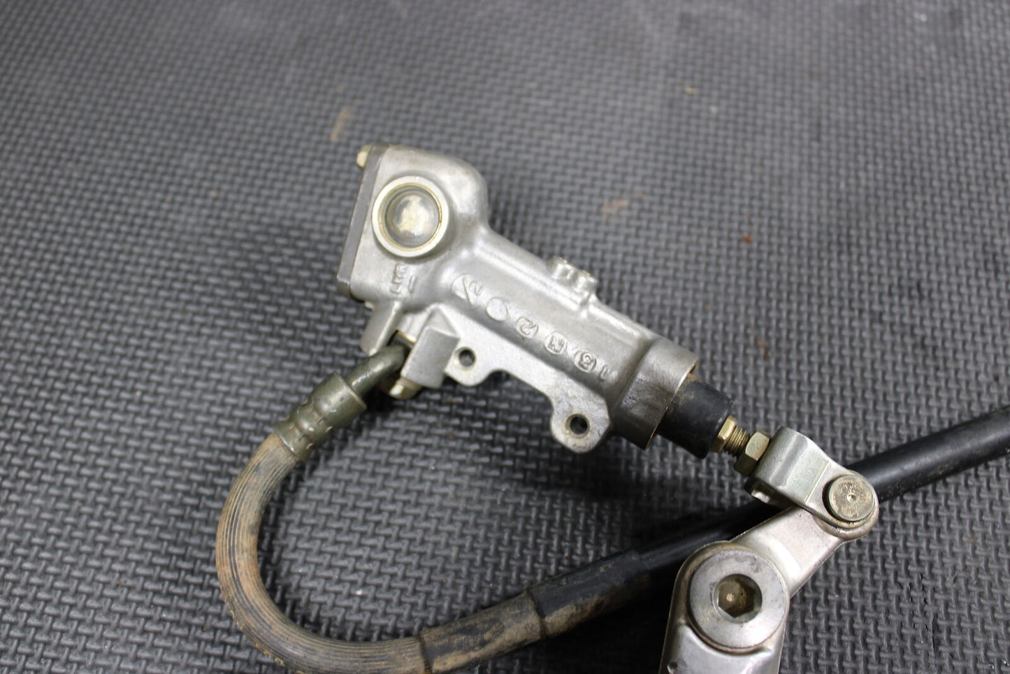 2004 KAWASAKI KX250F OEM REAR BACK BRAKE MASTER CYLINDER CALIPER ASSEMBLY